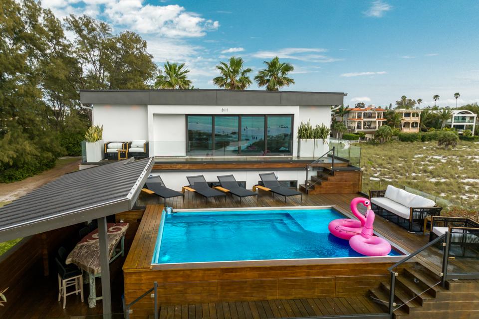 A charming pool adorned with a flamingo, showcasing the beauty and relaxed vibe of vacation rentals on Anna Maria Island, Florida