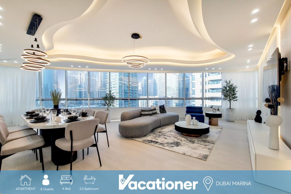 The living room and dining room of a luxury property of Vacationer Dubai located in Dubai Marina.