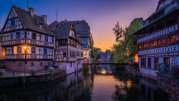 Strasbourg’s La Petite France glows at sunset, its iconic half-timbered houses and tranquil canals offering a magical blend of history and beauty.