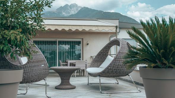 An inviting outdoor living space at a short-term rental property, the kind of amenity detail that signals listing quality to Google and helps property managers stand out in metasearch results.